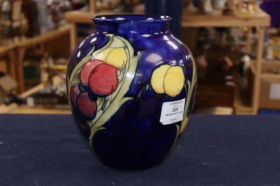 A Moorcroft blue ground Wisteria pattern vase height 22cm